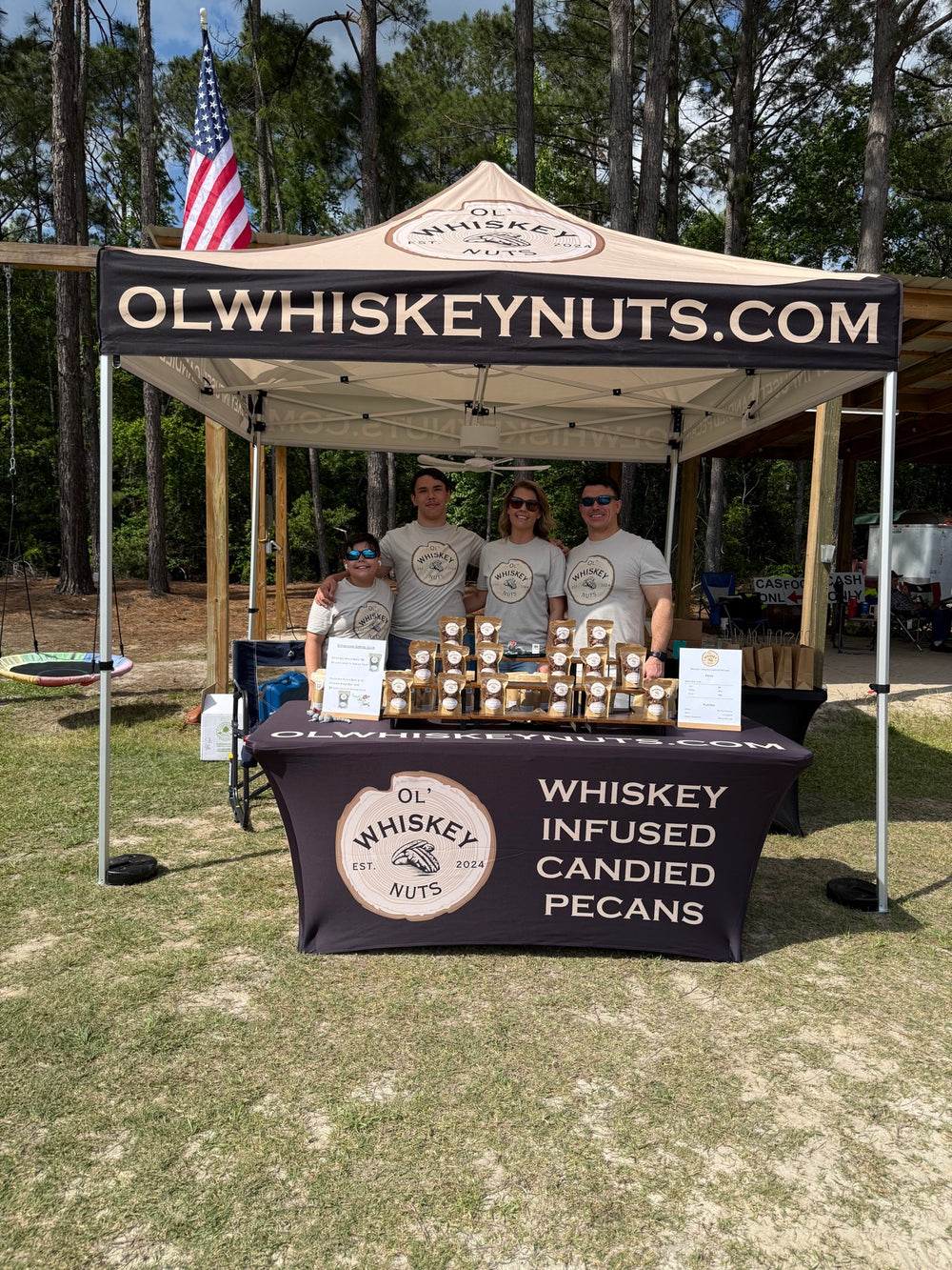 The Ol' Whiskey Nuts family at their market tent
